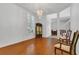 Elegant living room features hardwood floors, bright light fixture, and refined decor at 1731 Knotting Hill Dr, Orlando, FL 32835