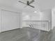 Open loft area with wood-look floors and stairs visible at 1731 Knotting Hill Dr, Orlando, FL 32835