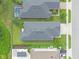 Aerial view of the roof, driveway, and backyard, highlighting the property's layout and landscaping at 17860 Passionflower Cir, Clermont, FL 34714