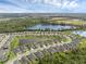 Wide aerial shot depicts the community set amidst several lakes and natural greenery, highlighting the neighborhood's peaceful setting at 17860 Passionflower Cir, Clermont, FL 34714