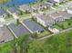 Aerial view outlines the property's boundaries and lot size in a well-maintained neighborhood with green spaces and community lake at 17860 Passionflower Cir, Clermont, FL 34714