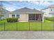 Fenced backyard with covered patio at 17860 Passionflower Cir, Clermont, FL 34714