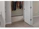 View of walk-in closet with hanging clothes from doorway at 17860 Passionflower Cir, Clermont, FL 34714