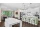 Modern kitchen with a spacious island, stainless steel appliances, and an adjacent living area at 17860 Passionflower Cir, Clermont, FL 34714