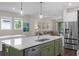 A gourmet kitchen provides a large island and view into the living space at 17860 Passionflower Cir, Clermont, FL 34714