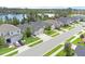 Charming single-Gathering homes lined along a street showcase manicured lawns near a tranquil lake at 17860 Passionflower Cir, Clermont, FL 34714