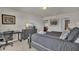 Well-lit bedroom featuring a work space and relaxing atmosphere at 1935 Majorca Dr, Kissimmee, FL 34747