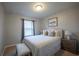 Comfortable bedroom with neutral tones, a queen-sized bed, and plenty of natural light at 1935 Majorca Dr, Kissimmee, FL 34747