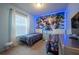 Charming themed bedroom with two twin beds, large window, and a bright accent wall at 1935 Majorca Dr, Kissimmee, FL 34747