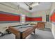 Features a pool table and foosball table, perfect for entertainment in this versatile space at 1935 Majorca Dr, Kissimmee, FL 34747