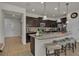 Modern kitchen features granite counters, stainless steel appliances, a center island with pendant lighting at 1935 Majorca Dr, Kissimmee, FL 34747