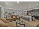 Open-concept living room with a kitchen island and breakfast bar seating for casual dining at 1935 Majorca Dr, Kissimmee, FL 34747