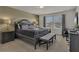 Spacious main bedroom featuring a king-size bed, elegant decor, and plenty of natural light at 1935 Majorca Dr, Kissimmee, FL 34747