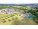 Aerial view showing school, playground, and basketball court in a large community area at 2031 Gloria Oak Ct, Orlando, FL 32820