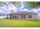 Wide backyard with green grass and a nice patio at 2031 Gloria Oak Ct, Orlando, FL 32820