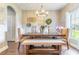 Stylish dining room with a modern chandelier, decorative wall art, and natural light at 2031 Gloria Oak Ct, Orlando, FL 32820