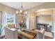 Open dining room with view to front entry and a billiard room beyond at 2031 Gloria Oak Ct, Orlando, FL 32820