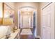 Elegant entryway featuring hardwood floors, arched doorways, and decorative lighting at 2031 Gloria Oak Ct, Orlando, FL 32820