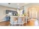 Open kitchen with counter seating, stainless appliances, and neutral countertops at 2031 Gloria Oak Ct, Orlando, FL 32820