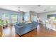 Bright living room featuring a ceiling fan, wood floors, and natural light at 2031 Gloria Oak Ct, Orlando, FL 32820