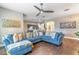 Spacious living room with a comfortable sectional, wood floors and open floorplan at 2031 Gloria Oak Ct, Orlando, FL 32820