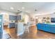 Open floor plan showcasing kitchen with bar seating flowing into living area at 2031 Gloria Oak Ct, Orlando, FL 32820