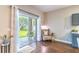 Bright reading nook in living area with backyard view and hardwood floors at 2031 Gloria Oak Ct, Orlando, FL 32820