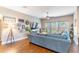 Comfortable living room with wood floors, ceiling fan, and plenty of natural light at 2031 Gloria Oak Ct, Orlando, FL 32820