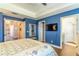 Bedroom with hardwood floors, tray ceiling, and multiple closets at 2031 Gloria Oak Ct, Orlando, FL 32820