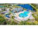 Aerial view of a community pool with a fountain, waterslides, and lounge chairs at 2031 Gloria Oak Ct, Orlando, FL 32820