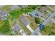 Aerial view of home showing roof, driveway and proximity to nearby neighbors at 2033 E Gloria Dr, Deltona, FL 32725