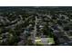 A high-angle aerial shot of the home nestled within its surrounding neighborhood at 2033 E Gloria Dr, Deltona, FL 32725
