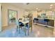 Spacious eat-in kitchen with island seating, stainless steel appliances, and bright natural light at 2033 E Gloria Dr, Deltona, FL 32725