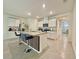 Modern kitchen island with granite countertop, pendant lighting, and stainless appliances at 2033 E Gloria Dr, Deltona, FL 32725