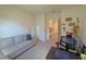 Relaxing living room with a comfortable sofa, desk, and view to the hallway at 2033 E Gloria Dr, Deltona, FL 32725