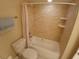 Bathroom featuring a shower-tub combo with tiled walls, offering a clean and functional space at 2414 Willow Oak Dr, Edgewater, FL 32141