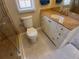 Bathroom vanity with granite counters, white cabinets, and a tile floor at 2414 Willow Oak Dr, Edgewater, FL 32141