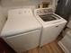 Laundry room with a dryer and a washer with wooden floors at 2414 Willow Oak Dr, Edgewater, FL 32141