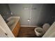 A bathroom featuring a sink, toilet, and tiled floor at 266 Vervain Ave, Davenport, FL 33837