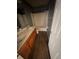 Bathroom with double sinks, wood-look flooring, and a tub/shower combo with a shower curtain at 266 Vervain Ave, Davenport, FL 33837
