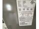 Close-up of the HVAC unit's specification label, providing detailed technical information at 266 Vervain Ave, Davenport, FL 33837