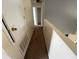This upstairs hallway features carpet flooring and linen closets at 266 Vervain Ave, Davenport, FL 33837