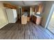 Spacious kitchen with wood-look floors, stainless steel appliances, and sliding glass door at 266 Vervain Ave, Davenport, FL 33837