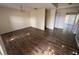 A bright living room featuring wood-look floors and a chandelier at 266 Vervain Ave, Davenport, FL 33837