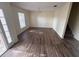 A large living room featuring hardwood floors and a chandelier at 266 Vervain Ave, Davenport, FL 33837