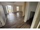 An open concept living room boasts hard wood floors and lots of natural light at 266 Vervain Ave, Davenport, FL 33837