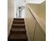 A carpeted staircase leads to the second floor of the home at 266 Vervain Ave, Davenport, FL 33837