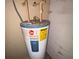 Rheem water heater with energy guide label, showcasing the home's hot water system at 266 Vervain Ave, Davenport, FL 33837