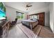 This is a primary bedroom features a large window and ceiling fan with lots of storage space at 2698 River Creek Ln, St Cloud, FL 34771