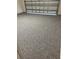 Spacious garage with a stylish, speckled epoxy floor, and a durable overhead door at 2698 River Creek Ln, St Cloud, FL 34771